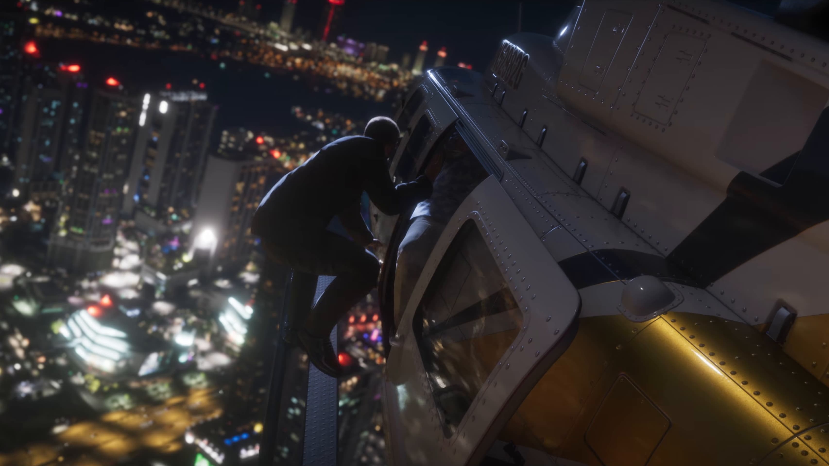 A man clinging to the side of a helicopter above Vice City lights at night