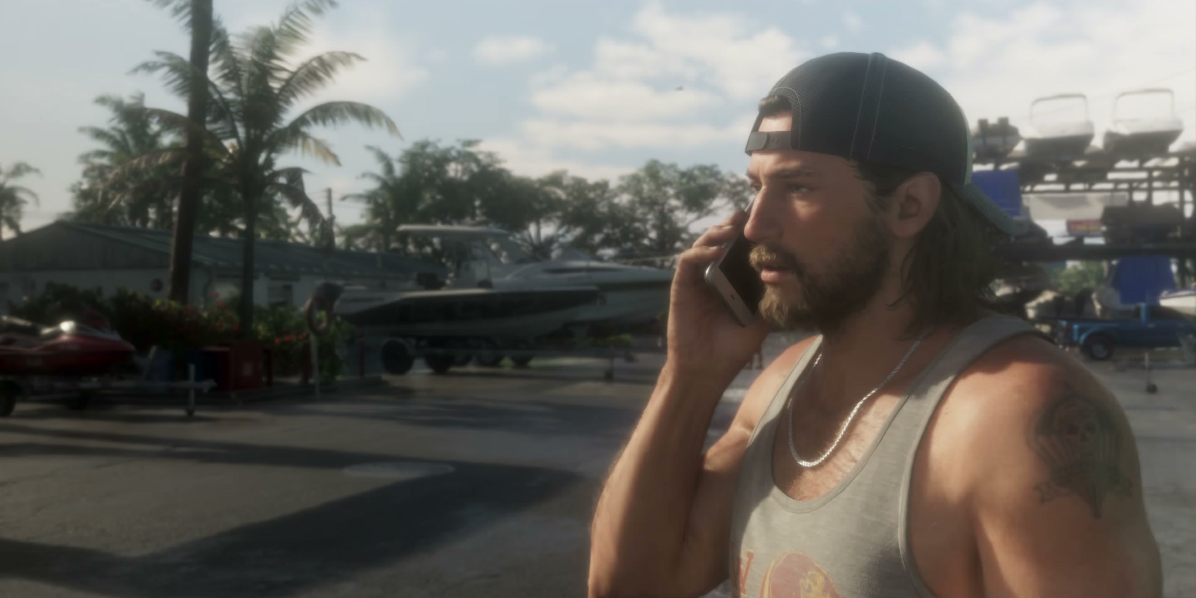 Jason, cap on backwards, talks on his phone at a marina